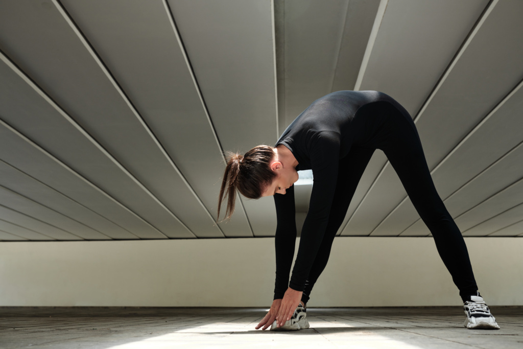 A woman doing stretches to help her body stay strong and resilient after a fall.