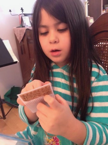 My daughter helping me stitch on the log cabin. 
