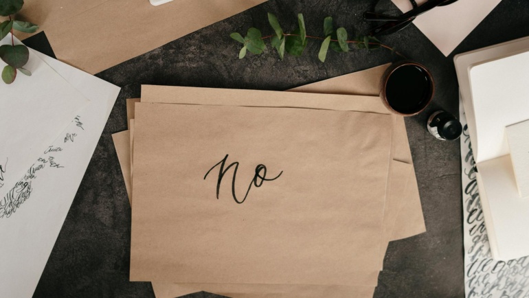 Saying no with a brown paper with handwritten text