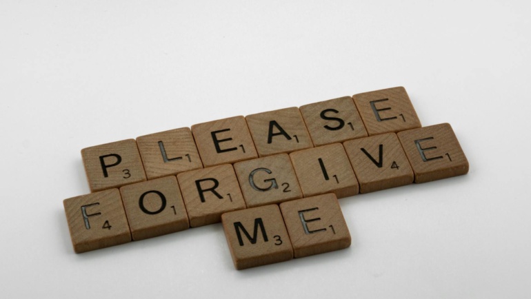 Forgiveness and your health. A close up shot of scrabble tiles on a white surface
