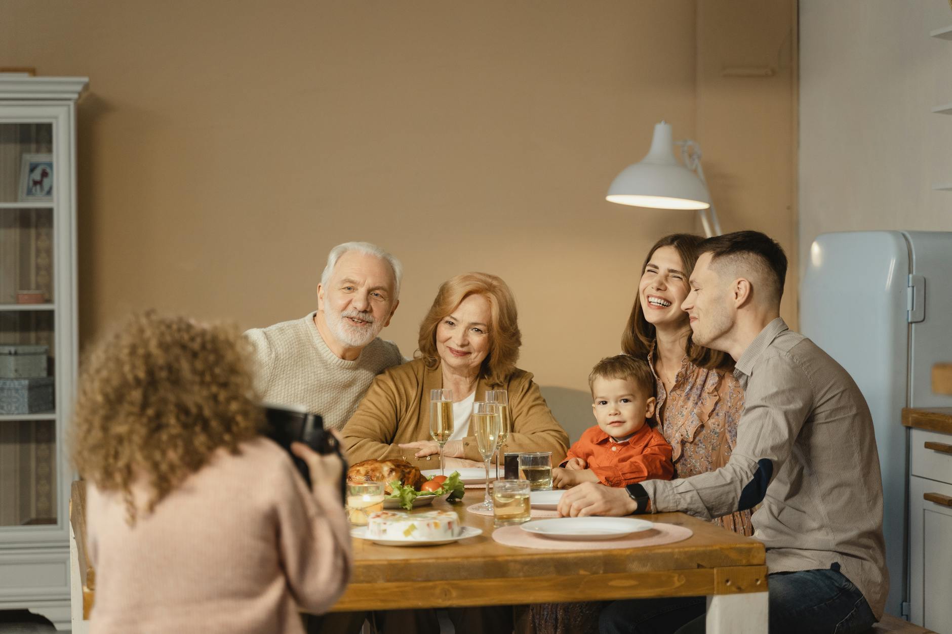 group of people sitting on chair in front of table